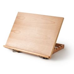 a wooden cutting board sitting on top of a white surface