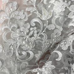 Look no further than Lace USA for the perfect beaded and corded bridal fabric lace for your special event. Our handcrafted, high quality lace material is inlaid with intricate pearls, sequins and beads and is embroidered on 100% polyester net mesh. It's perfect for a wedding dress, evening gown, dance costume or quinceanera dress, and the fabric comes in 5 different color options. Our beaded and corded bridal fabric lace is the best choice for adding a touch of opulence to your special occasion. Elegant Wedding Fabric With Intricate Embroidery, Elegant Wedding Fabrics With Intricate Embroidery, Elegant Wedding Lace Fabric And Notions, Elegant Wedding Fabric With Lace Work, Embroidered Lace Wedding Dress For Mother Of The Bride, Intricate Lace Embroidery Fabric For Brides, Wedding Lace Fabric With Intricate Embroidery, Quinceanera Crown, Wedding Dress Evening