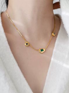 Elevate your style with this exquisite 18k gold-plated necklace, featuring a stunning array of colored gemstones. Each gemstone is meticulously set in a unique bezel, designed to showcase its natural brilliance and color. Crafted with precision, the necklace is made from durable, non-fading stainless steel, ensuring longevity and resistance to tarnish. The harmonious blend of green, blue, and clear gemstones offers a modern yet timeless appeal, making it the perfect statement piece for both everyday wear and special occasions. The sleek, minimalist chain adds a touch of elegance, allowing the colorful gemstones to take center stage. Details: Material: Non-fading stainless steel, 18k gold-plated Gemstones: Multi-colored gemstones (green, blue, clear) Design: Unique bezel settings for each g Elegant Gold Plated Stone Necklaces, Elegant Gold-plated Necklaces With Stones, Elegant Gold Plated Necklaces With Stones, Gold-plated Birthstone Necklace With Gemstones, Gold Plated Gold Necklace With Stones, Gold Plated Gemstone Accents Necklace, Gold Plated Gemstone Necklaces, Gold Plated Gemstone Accented Round Necklace, Fine Jewelry Gold Plated Necklaces With Gemstone Accents