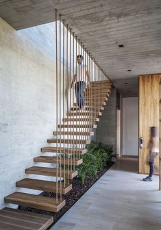 a man walking up the stairs in a house