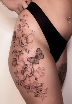 a woman's thigh with flowers on it