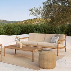 a couch and coffee table on a patio