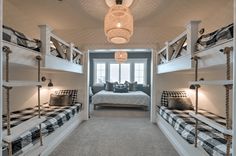 a bedroom with bunk beds and checkered pillows