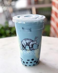 a blue cup sitting on top of a table