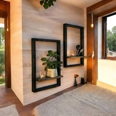 a living room with two shelves holding plants and candles on the wall next to a window