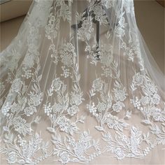 Heavy embroidered lace fabric with an amazing design and high quality about that product Dimensions Length: 1 Yards; Width: 51.5 Inches Primary fabric: Tulle Primary fiber: Rayon Secondary fiber: Nylon Color: off-white ❀❀ About the sample❀❀ If you need to check the quality and pattern of the lace fabric, we can provide you with a small sample; when you confirm the order, we will refund the sample fee for you. Perfect for dress making, bridal wear, wedding gown, bodice or curtains ❀❀ MEASUREMENTS Robe Diy, Floral Lace Fabric, Tulle Embroidery, White Lace Fabric, Lace Accessories, Beaded Lace Fabric, Bridal Lace Fabric, Bridal Dresses Lace, Embroidered Lace Fabric