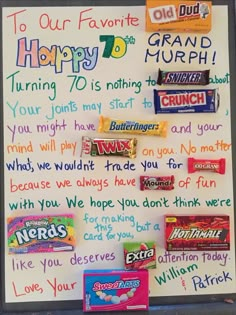 a bulletin board with candy and writing on it