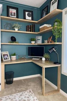 a home office with blue walls and shelves filled with books, plants, and pictures