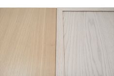 two different types of wood that are white and light brown, one is black and the other is beige