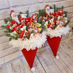 two red buckets filled with candy and candies