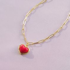 The heart-shaped pendant is meticulously formed from high-quality porcelain, known for its delicate yet durable nature. It is a perfect symbol of love and romance. The vibrant red glaze adds a pop of colour and warmth, making this necklace a standout piece that complements any outfit.   MATERIAL Handmade porcelain  18K Gold-plated brass   SIZE & FIT 39cm + 5cm; lobster clasp  COLOUR  Red, gold  WEIGHT 9g  Handmade pieces, therefore they may vary slightly from piece to piece. Gold- or silver-plat Red Heart Charm Necklace For Her, Red Heart Necklace For Her, Red Heart Pendant Necklace As Gift For Her, Red Heart Necklace As A Gift For Her, Red Enamel Heart Pendant Necklace, Red Heart Pendant Necklace, Soap Perfume, Red Heart Pendant, Hand Cleaning