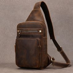 High Quality Big Chest Bag - Features & Qualities Material: 🐄 Cowhide Full Grain Leather: Made from the highest quality leather for durability and style. ✨ Handmade: Each bag is meticulously crafted by skilled artisans, ensuring a unique and high-quality piece. Design & Functionality: 📏 Dimensions: 38cm (15 inches) height, 20cm (7.9 inches) width, and 7cm (2.8 inches) depth. ⚖️ Lightweight: Weighs only 0.6kg (1.3 lbs), making it easy to carry around all day. 📐 Spacious: Multiple compartments Leather Sling Bag Men, Mens Waist Bag, Sling Bag Men, Sling Bag For Men, Chest Pack, Hiking Bag, Utility Bag, Leather Sling Bag, Vintage Leather Bag