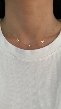 This 14K gold necklace features 2 letters + 1 dangling diamond baguette in between. Choose 2 letters to create your custom necklace! EXAMPLE: Left Letter: O Right Letter: M Available in 14K Yellow Gold or 14K White Gold Letter Measurement: Approx. 0.20" (varies slightly per letter) Uppercase letters only Letters and diamond spaced approx. 1" apart Diamond baguette: 3mm x 1.5mm - 0.05ct. FINAL SALE O Necklace Letter, O Necklace, Diamond Letters, Letters Necklace, Pretty Jewelry Necklaces, Diamond Baguette, Gold Letter, Letter O, 14k Gold Necklace