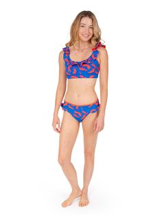 Double the Ruffle Fun with our matching Lola Bikini Bottom Make waves with our matching ruffle bikini bottom, designed to perfectly complement your Lola reversible ruffle bikini top! This flirty, feminine silhouette boasts the same playful ruffles, offering two chic patterns in one for endless mixing and matching possibilities. Dive into the details: Reversible design: Seamlessly switch between two vibrant patterns to match your mood and outfit. Fully reversible, two sided design. Flattering fit Playful Ruffle Tankini For Vacation, Playful Ruffled Tankini For Vacation, Playful Ruffled Tankini For The Beach, Vacation Swimwear With Ruffles And Tie-side Bottom, Playful Ruffled Tankini For Beach Season, Stretch Tankini With Ruffles For Pool, Stretch Ruffled Tankini For Pool, Playful Ruffled Swimwear For The Beach, Playful Ruffled Swimwear For The Pool