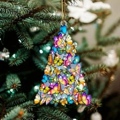 a colorful ornament hanging from a christmas tree