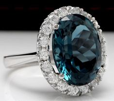 13.20 Carats Natural Impressive LONDON BLUE TOPAZ and Diamond 14K White Gold Ring Suggested Replacement Value $7,300.00 Total Natural London Blue Topaz Weight: 12.00 Carats London Blue Topaz Measures: 16.00 x 12.00mm Natural Round Diamonds Weight: 1.20 Carats (color G / Clarity SI1) Ring total weight: 8.4 grams Disclaimer: all weights, measurements and colors are approximate and may vary slightly from the listed dimensions or as seen in the image. All pictures are magnified to show the smallest Emerald Cut Aquamarine Ring, Emerald Cut Rings, Etsy Gold Ring, 14k White Gold Ring, London Blue Topaz, White Gold Ring, London Blue, Yellow Gold Rings, White Gold Rings