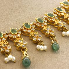 A lovely decorative piece featuring faceted and cabochon emerald drops, natural seed pearls and a plethora of diamonds! They are all set in 22k yellow gold giving the necklace a bright yellow color.    Length: 15.5 inches    Weight: 38.3 grams Elegant Hand-set Emerald Necklace In Yellow Gold, Gold Emerald Bead Necklaces, Elegant Gold Emerald Necklace With Faceted Beads, Luxury Hand-set Yellow Gold Emerald Necklace, Luxury Polished Bead Emerald Necklace, Seed Pearl, Emerald Diamond, Bright Yellow, Yellow Color