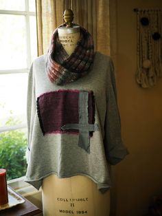 You'll get many compliments wearing this unique one of a kind sweater.  It is a soft comfortable v-neck in gray 100% cotton.  The linen design in front is from authentic Japanese hand-dyed linen.  The lower edge of the sweater curls naturally with the exposed raw edge. This is one size fits all and is easy to style with boots and leggings.  Add a scarf and your all set to run about town. Linen Design, Boots And Leggings, Pullover Outfit, Dyed Linen, Pullover Sweater Women, Raw Edge, Women Pullover, One Size Fits All, Pullover Sweaters