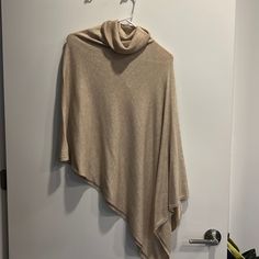 Kerisma Tan Poncho Beige Batwing Sleeve Poncho For Fall, Chic One Size Poncho With Batwing Sleeve, Cream Long Sleeve Poncho, Chic One-size Poncho Shawl, Chic One-size Cape Poncho, Chic One Size Cape Poncho, Elegant Long Sleeve One Size Poncho, Yarn Shawl, Black Shrug