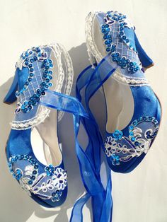 "Royal blue and ivory lace wedding shoes for bride, custom heel heights and shoe styles available. These shoes will be your \"something blue\" on your wedding day! Perfect wedding gift, bridesmaids gift, bachelorette gift or engagement gift. Royal blue satin bridal shoes are designed with ivory embroidered lace. Blue beads and sequins are used on the embroidery and blue organza ribbons tie on the front. They are made of soft smooth satin and delicate lace, each handmade item is unique and can di Blue Wedding Shoes For Bride, Blue Satin Shoes, Royal Blue Wedding Shoes, Lace Wedding Shoes, Lace Bridal Shoes, Custom Heels, Wedding Shoes For Bride, Blue Bridal Shoes, Teal Heels