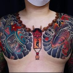 a man wearing a face mask with tattoos on his chest and chest is covered by a medical mask