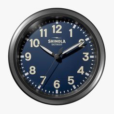 a blue clock with the words shinola on it's face and numbers displayed