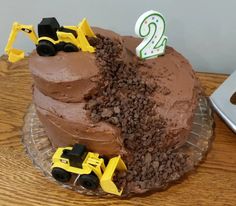 a birthday cake that is shaped like a construction truck and has the number twenty two on it