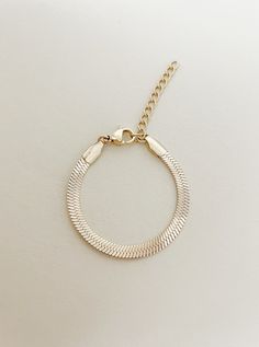 This piece has been in the works for awhile and I am so happy to finally have it available! 4mm herringbone chain bracelet for sizes newborn to adult. This is a perfect sleek and everyday look bracelet with the perfect amount of gold and sparkle! Each bracelet has 1.5-2 inches of extra chain to last for years!  These are perfect for birthdays, holidays, weddings, any special occasion. It is a perfect statement piece.  Water Resistant - WATERPROOF- You can wear gym, pool, shower or everywhere *Ta Adjustable Jubilee Snake Chain Bracelet, Adjustable Snake Chain Bracelet For Everyday, Adjustable Snake Chain Bracelet With Lobster Clasp, Adjustable Snake Chain Bracelet, Adjustable Snake Chain Jewelry For Everyday, Metal Snake Chain Bracelet As Gift, Adjustable Tarnish Resistant Gold Snake Chain Bracelet, Adjustable Gold Snake Chain Bracelet, Metal Charm Bracelet With Snake Chain As Gift