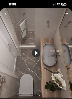 an aerial view of a bathroom with toilet and sink