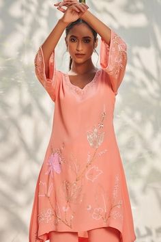 Peach tunic featuring flared sleeves and sequin and cutdana embroidery. Paired with coordinating flared pant for a complete look., Fit: Relaxed Festive Georgette Sets With Cutdana Details, Festive Peach Cutdana Sets, Festive Peach Fitted Kurta, Festive Semi-stitched Peach Sharara, Designer Semi-stitched Peach Kurta, Peach Crepes, Tunic Pattern, Embroidered Tunic, Flare Pants