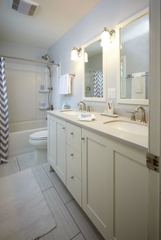 a bathroom with two sinks and a bathtub