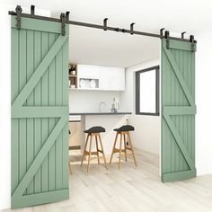 two stools sit in front of an open door to a kitchen with white walls