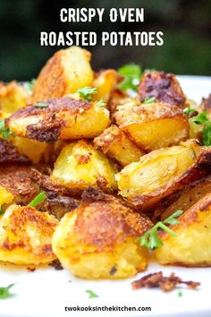 a white plate topped with fried potatoes and parsley