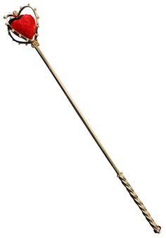 a red heart shaped flower on top of a long metal stick with an arrow sticking out of it