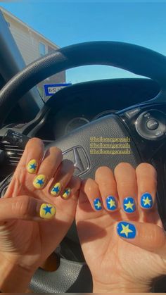 summer nail inspo, nails inspo, yellow nails, blue nails, star nail design, gel x ideas Blue And Yellow Star Nails, Each Hand Different Color Nails, Shirt Nail Inspiration, Cute Nail Ideas Blue, Football Gel Nails, Blue And Yellow Nails Short, Ucla Nails, Yellow Star Nails, Running Nails