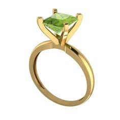 a yellow gold ring with a green stone