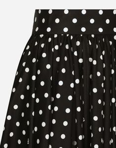 Cotton poplin calf-length circle skirt with polka-dot print: Black and White High-waisted Unlined Rear zipper and hook-and-eye fastening The piece measures 75 cm from the waist down on a size IT 40 The model is 175 cm tall and wears a size IT 40 Made in Italy The difference in the print placement that you may find on this product is a feature of Dolce & Gabbana’s “Handmade” pieces. A detail that makes every garment or accessory unique and exclusive. Polka Dot Fitted Full Skirt, Dalmatian Skirt, Dolce And Gabbana Print, Fitted Polka Dot Knee-length Skirt, Polka Dot Knee-length Flowy Skirt, Dolce And Gabbana Skirt, Polka Dot Print, Circle Skirt, Cotton Poplin