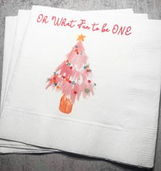 three napkins with hand prints on them, one has a christmas tree and the other says oh what fun to be one