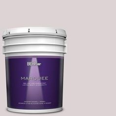 a bucket of behr marquee paint on a beige background with the lid open