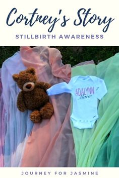 there is a teddy bear laying next to some baby clothes and the words, cootey's story still birth awareness