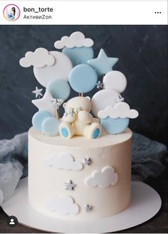 a white cake with blue and white decorations