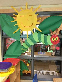 the very hungry caterpillars are hanging from the window in front of the classroom