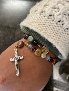 brown stone beads with a gold ish brown St. Benedict. Medel Brown Stone, St Benedict, Saint Benedict, Rosary Bracelet, Rosary, Stone Beads, Jewelry Bracelets, Beaded Bracelets, Bracelet