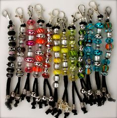 a bunch of different colored beads and key chains