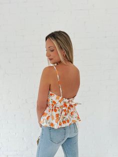 Turn heads and make a statement in this Southern Bell Smocked Top! This sassy yet fun peachy top features a smocked front, an open back, and matching bottoms. Perfect for those hot summer days - or your next vacay. Details: Length: 21" Bust: 32" Materials: SELF : 97% COTTON 3% SPANLINING : 100%COTTON Chic Smocked Top For Beach In Spring, Chic Spring Beach Smocked Top, Trendy Smocked Top For Beach In Summer, Trendy Summer Smocked Top For Beach, Trendy Summer Smocked Top For The Beach, Trendy Summer Beach Smocked Top, Trendy Cotton Smocked Top For Summer, Summer Smocked Top With Smocked Bodice For Vacation, Summer Smocked Top For Day Out