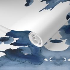 an artistic blue and white wallpaper with watercolor paint splattered on it