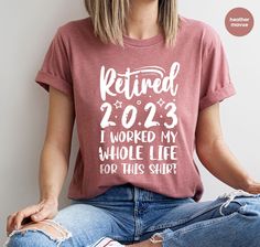 a woman sitting on the floor wearing a red shirt that says retired 2012 i worked my whole life top this shirt