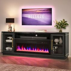 a television stand with a fire place in the center and a painting on the wall behind it