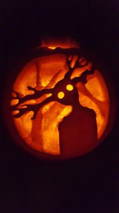 a pumpkin carved to look like a tree