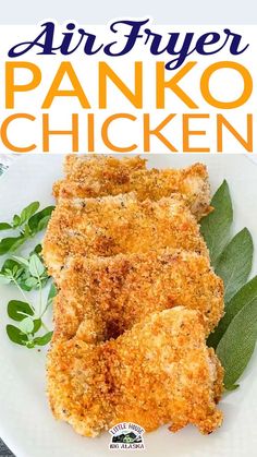 an air fryer panko chicken on a white plate with green leaves and herbs